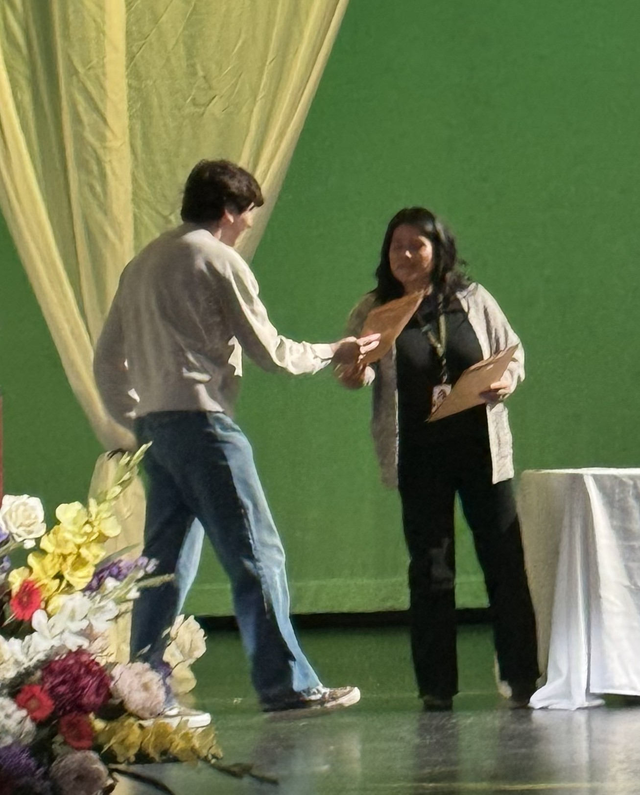 Jonah receiving the University of Rochester Frederick Douglass & Susan B. Anthony Award on stage